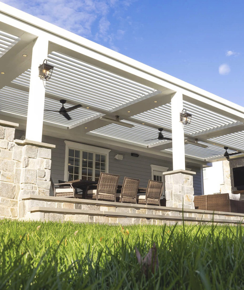 Motorized pergola with premium upgrades including integrated lighting, heaters, and ceiling fans Motorized pergola with premium upgrades including integrated lighting, heaters, and ceiling fans