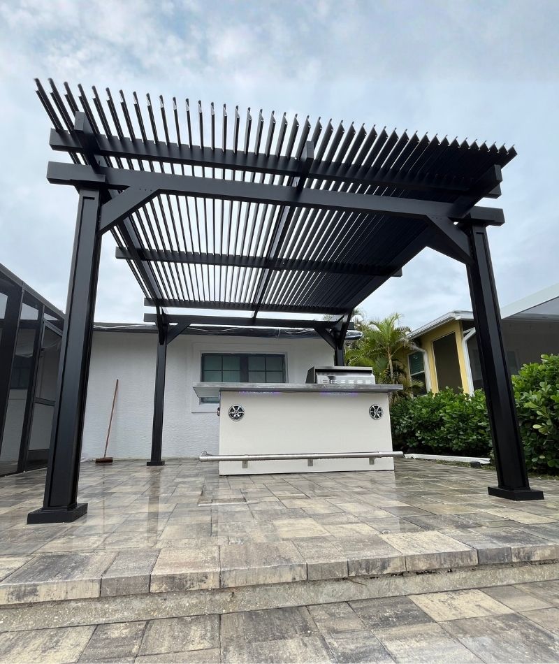 Black motorized pergola outdoor kitchen Cape Coral